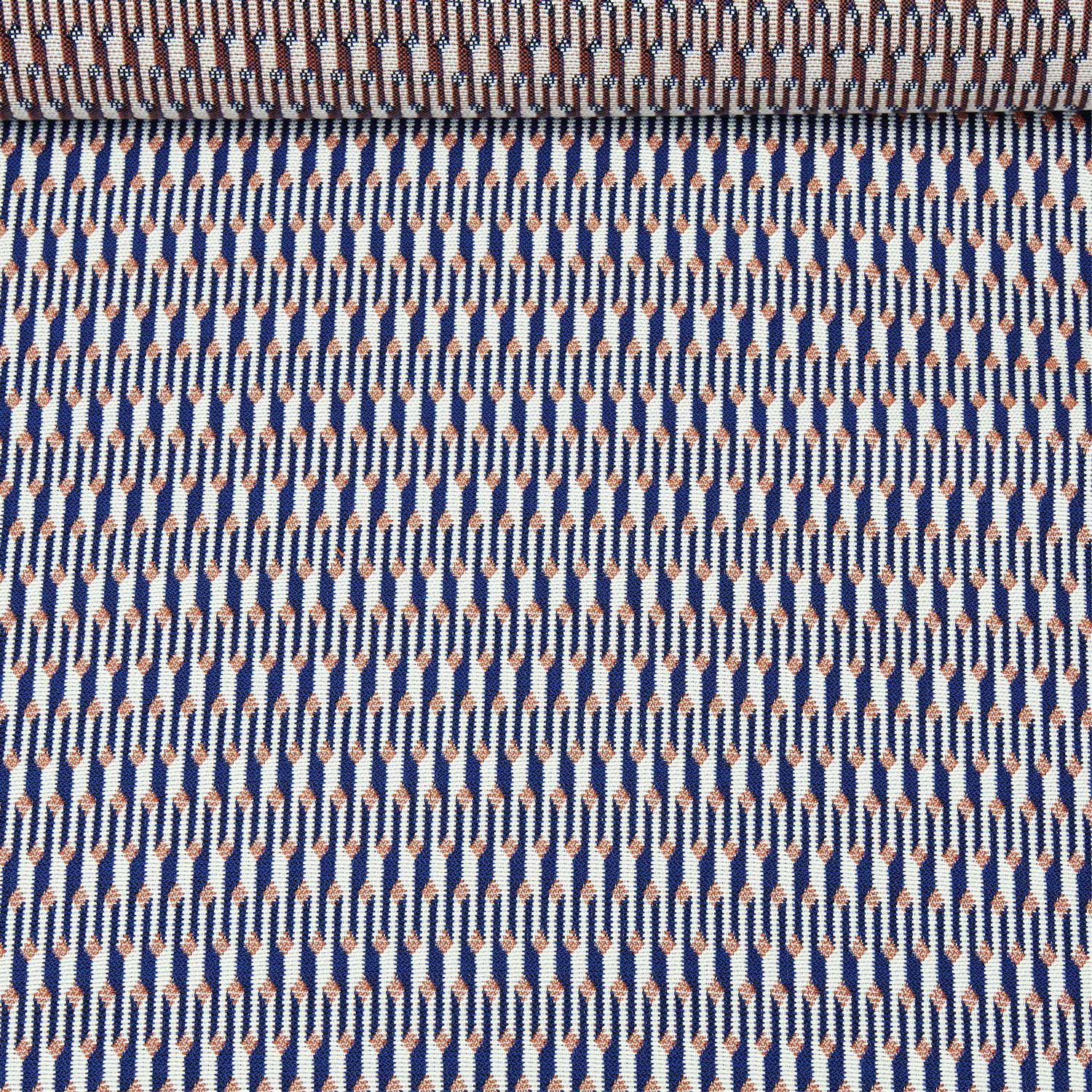 A birds eye view of a jacquard woven white, blue and orange outdoor performance fabric roll.
