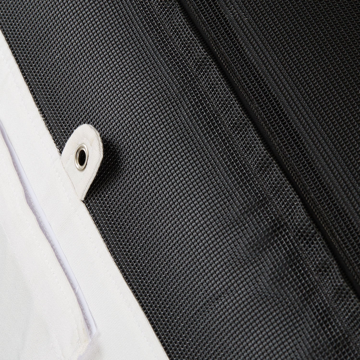 The base and eyelets of a white colored pool float for adults.