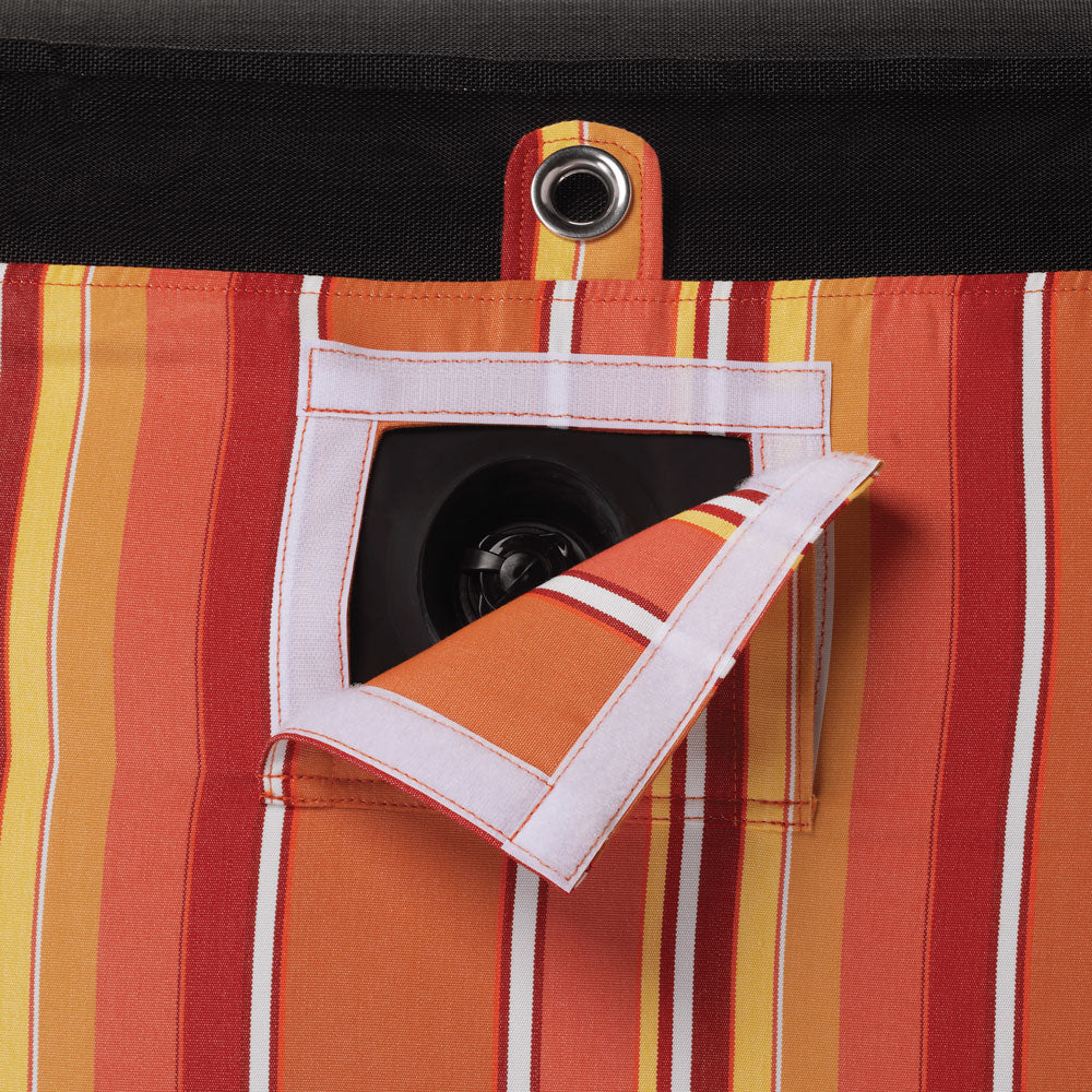 A pool float for an adult in a orange and white striped fabric upside down with a eyelet and velcro window showing a boston valve.