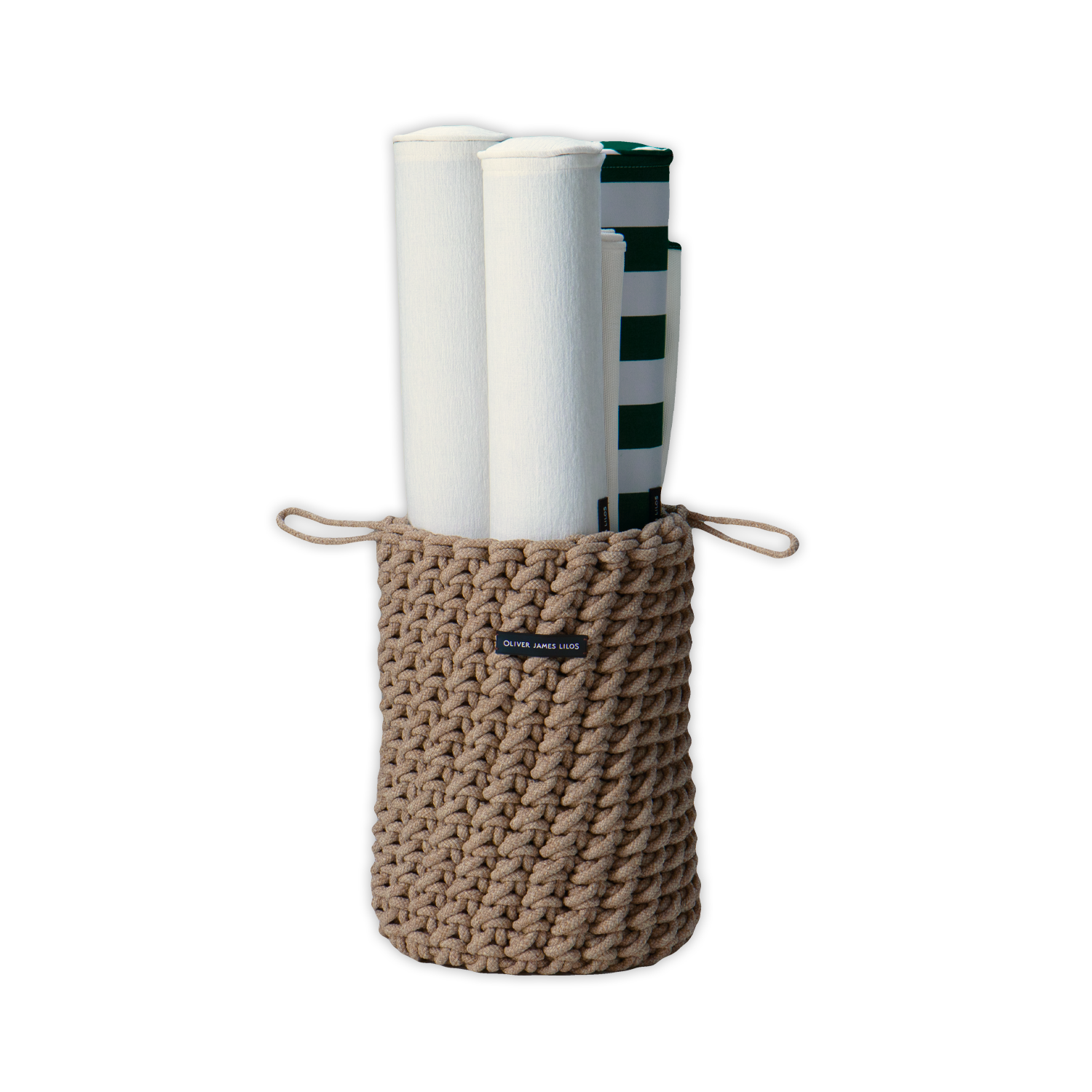 A hand-woven brown rope basket containing luxury pool float Hammocks.