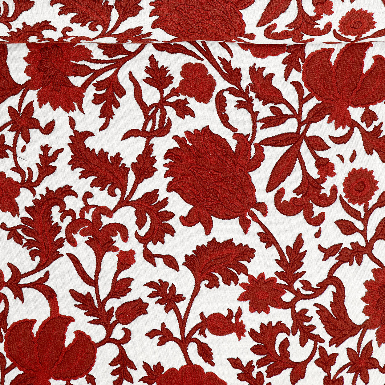 A birds eye view of a red and white fabric used to make luxury pool floats.