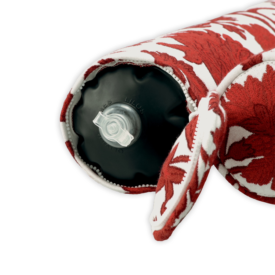 The valve details of a luxury pool float upholstered in red and white fabric.