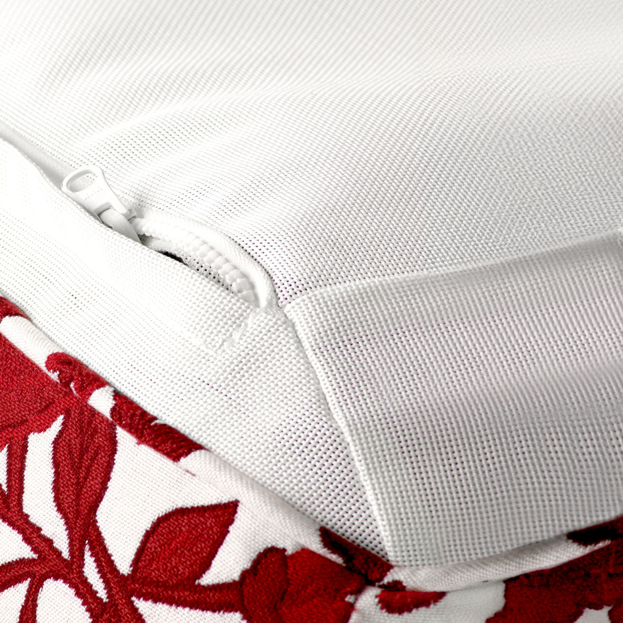 The base details of a luxury pool float upholstered in red and white fabric.