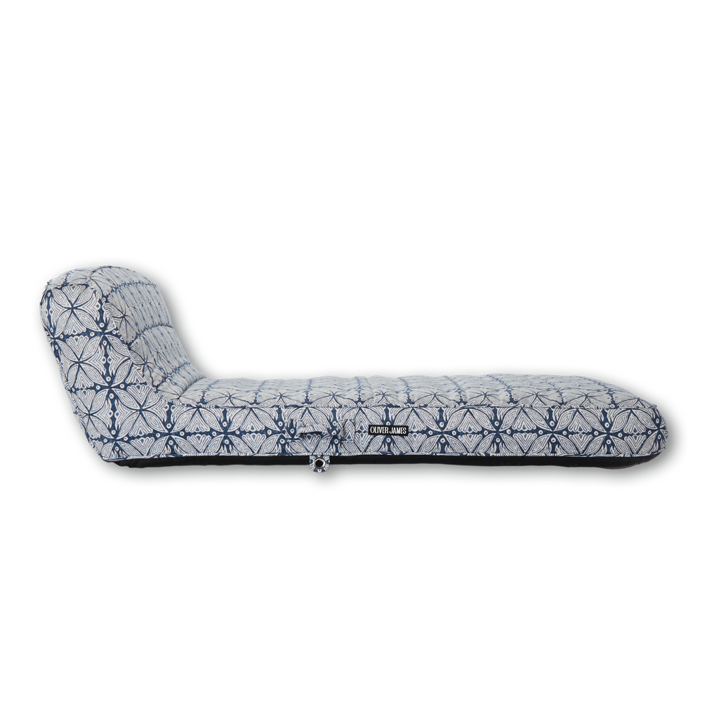 The side profile and backrest angle of a single blue and white patterned luxury pool float.