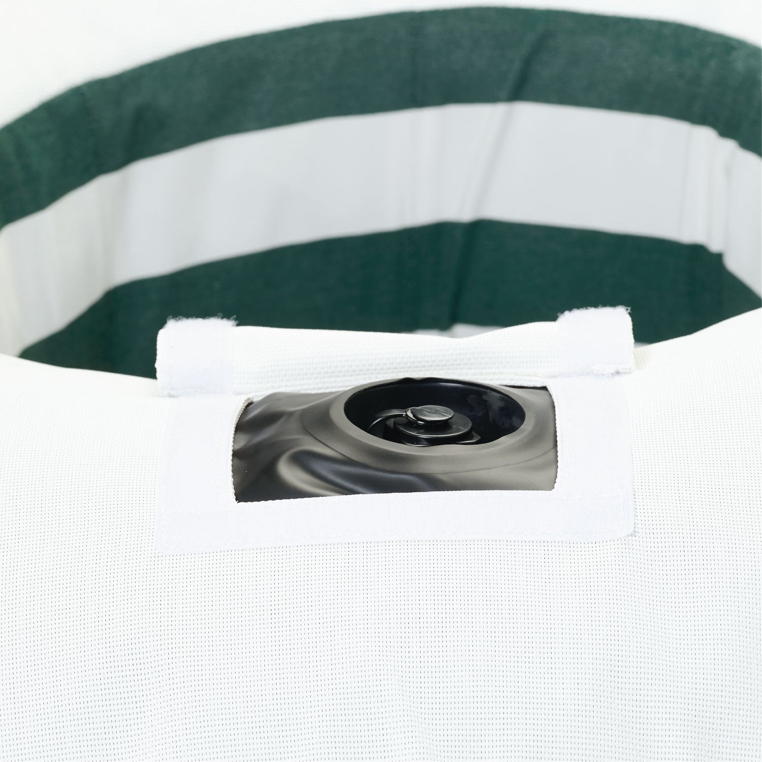A ring luxury lilo in green and white stripe upside down displaying the base and velcro window to access the boston valve.