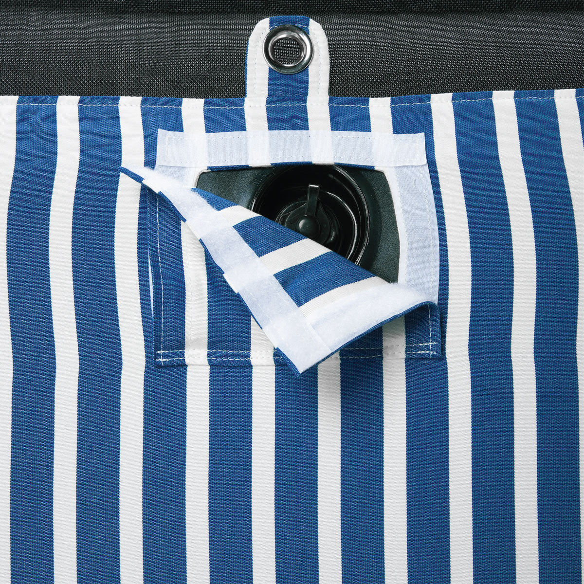 A pool float for an adult in a blue and white stripe fabric upside down with a eyelet and velcro window showing a boston valve.  