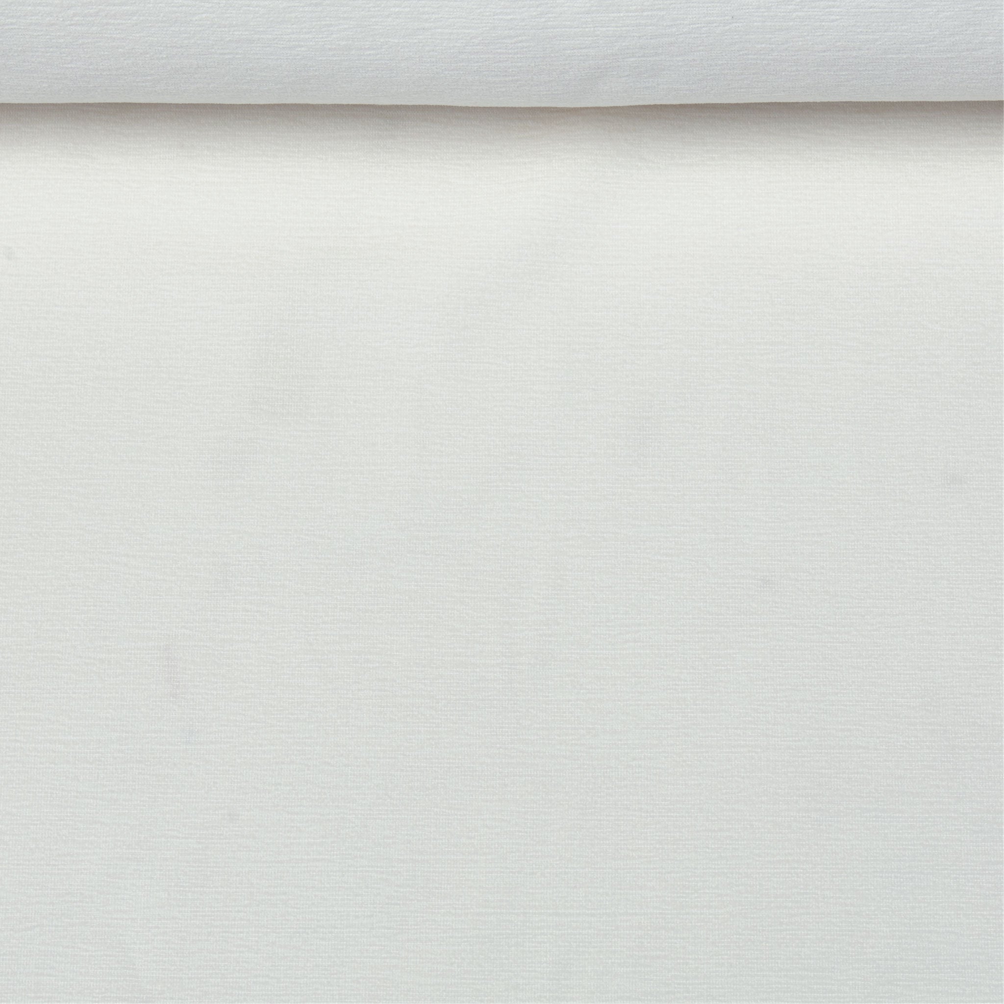 A birds eye view of a jacquard woven white terry toweled pattern outdoor performance fabric roll. 