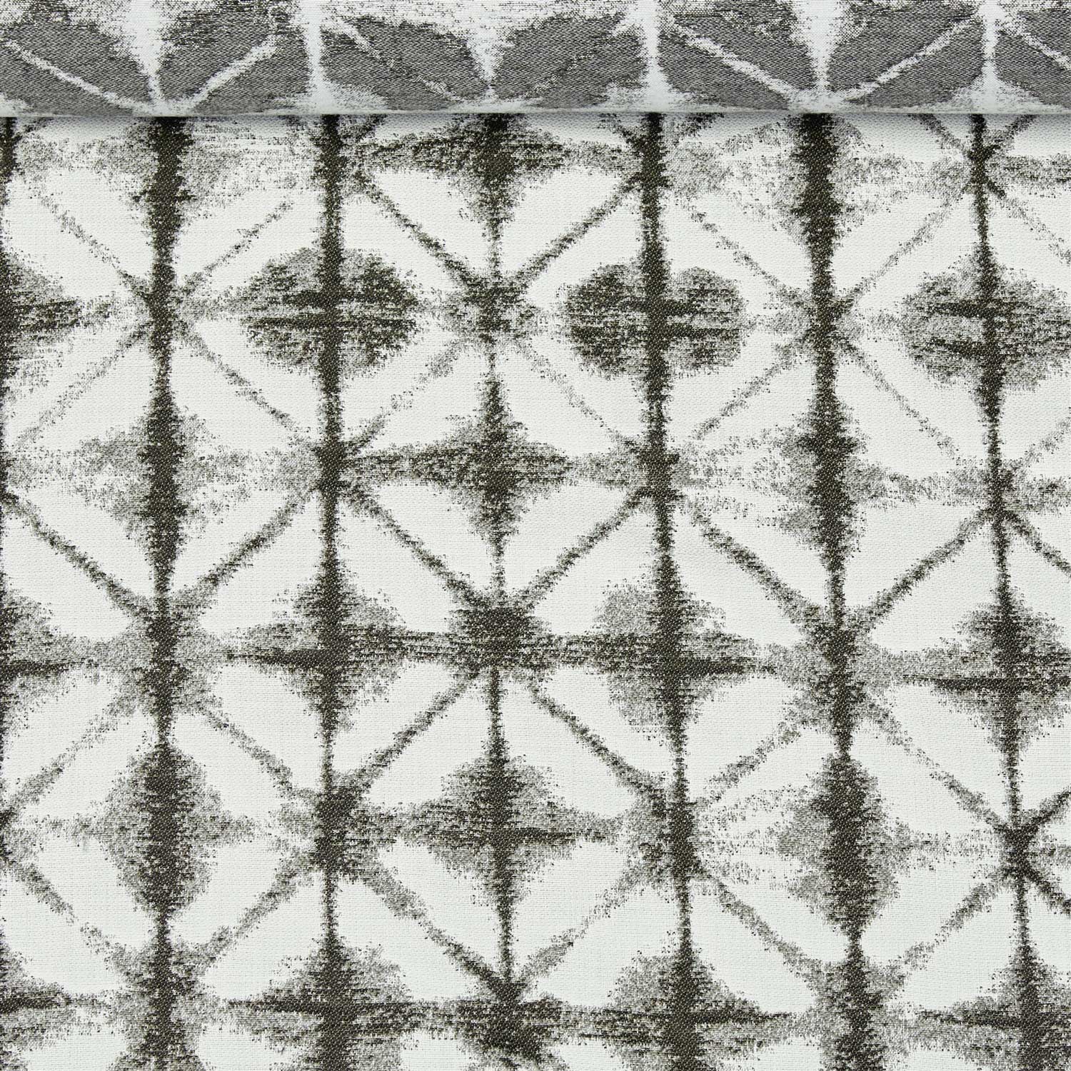 A birds eye view of a jacquard woven white and grey pattern outdoor performance fabric roll. 